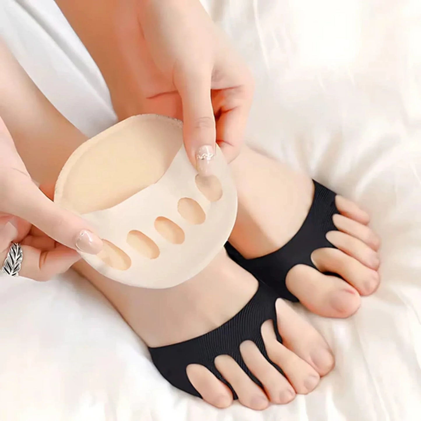 Gel toe separator foot pads for pain relief and foot support on person's feet